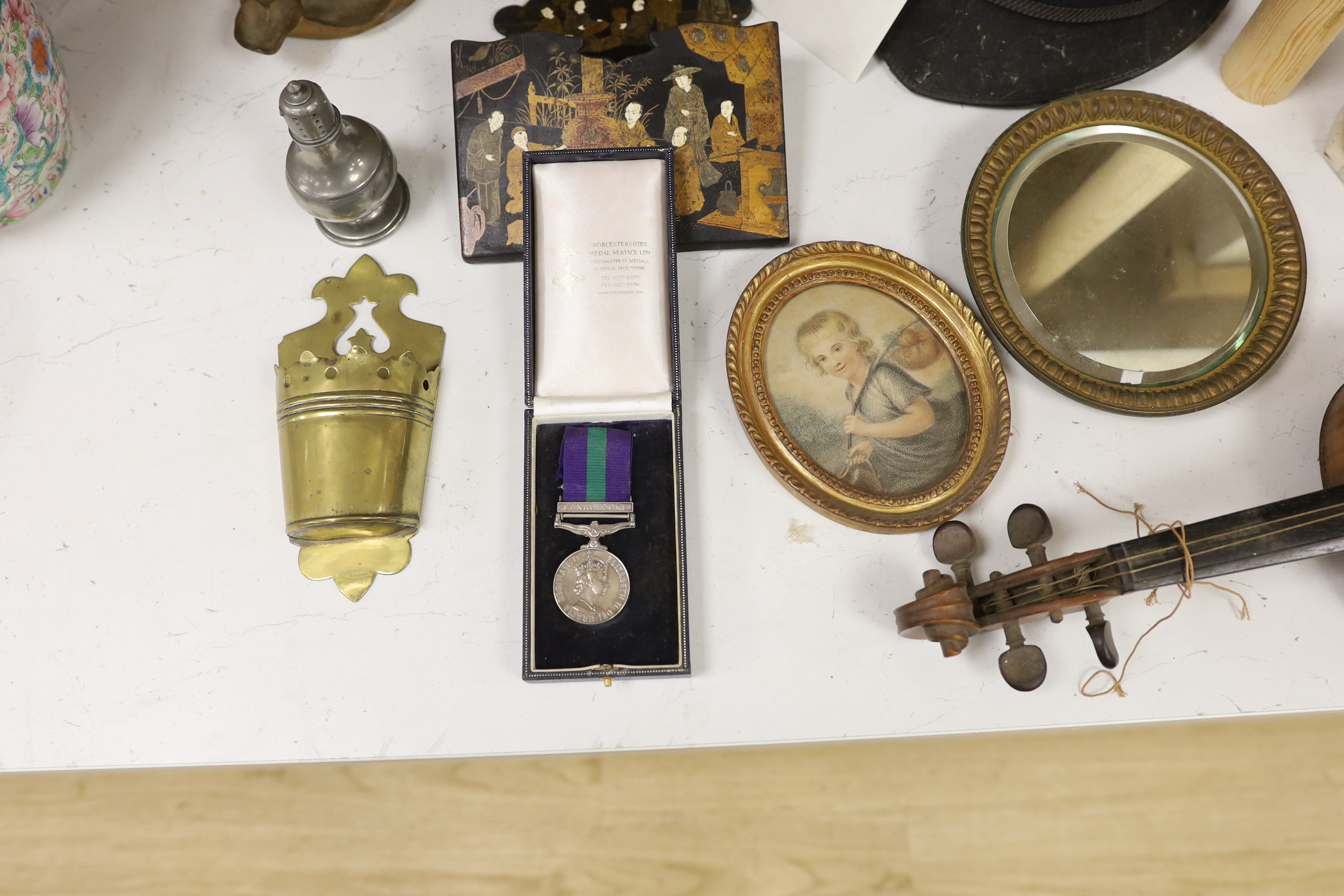 Mixed collectables - An early 20th century violin, interior label reads ‘Nicolaus Amatus fecit in Cremona 1651 Made in Czechoslavia’, an QEII General Service medal, CANAL ZONE bar, to AC1 P G DARLINGTON (2523204) RAF, a